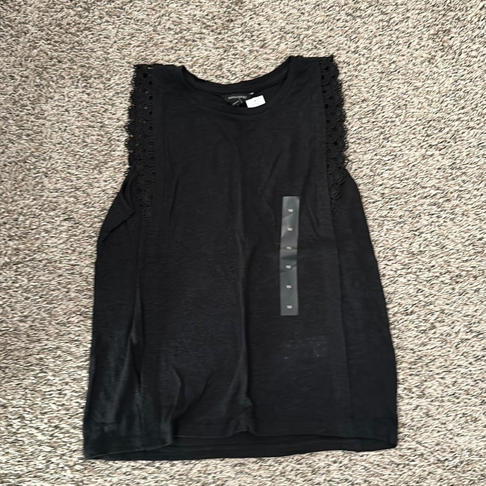 XS black tank with detailing around the shoulder